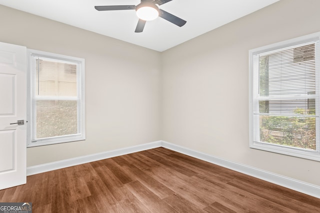 spare room featuring ceiling fan and hardwood / wood-style floors