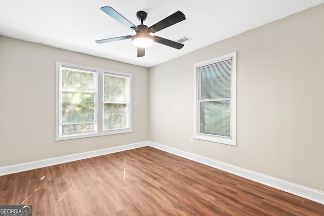 unfurnished room featuring hardwood / wood-style flooring and ceiling fan