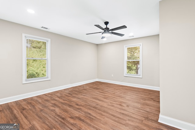 unfurnished room featuring ceiling fan and hardwood / wood-style flooring