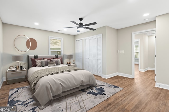 bedroom with light hardwood / wood-style flooring and ceiling fan