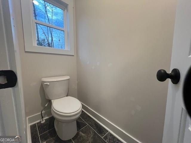 bathroom with tile patterned floors and toilet