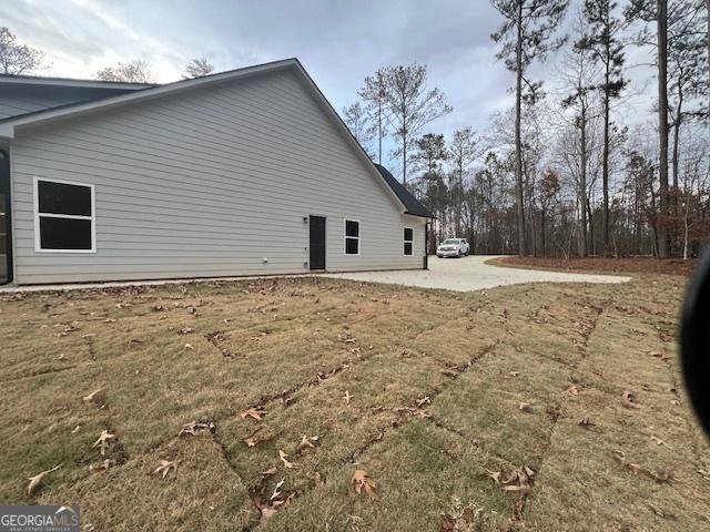 rear view of house with a yard