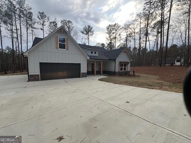 modern farmhouse style home with a garage