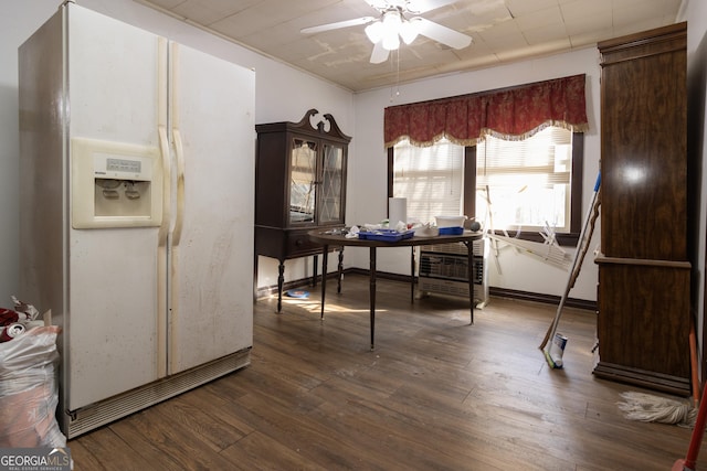 dining area featuring ceiling fan and dark wood-type flooring