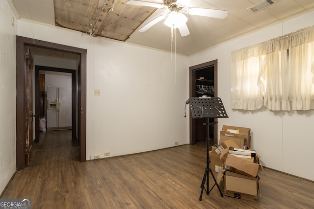 interior space featuring ceiling fan and dark wood-type flooring