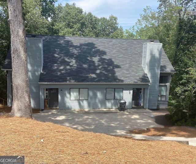 cape cod house with a chimney