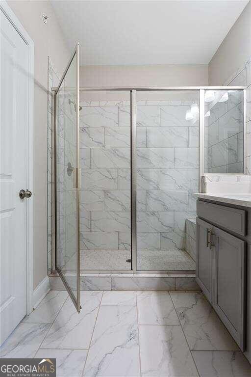 bathroom featuring vanity and walk in shower