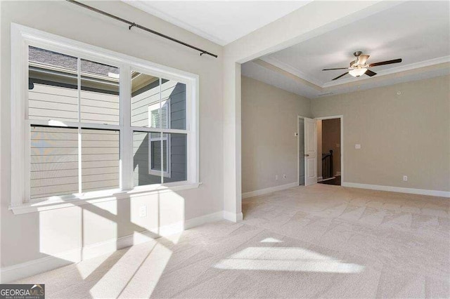 carpeted empty room with crown molding and ceiling fan