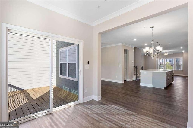 interior space with ornamental molding, dark hardwood / wood-style flooring, and a chandelier