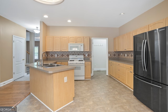 kitchen featuring white appliances, light hardwood / wood-style floors, tasteful backsplash, sink, and light brown cabinets