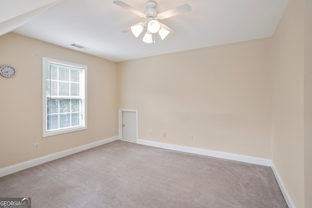 unfurnished room with carpet and ceiling fan