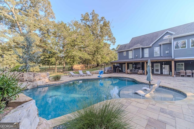 view of swimming pool featuring a patio area