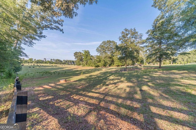 view of yard with a rural view