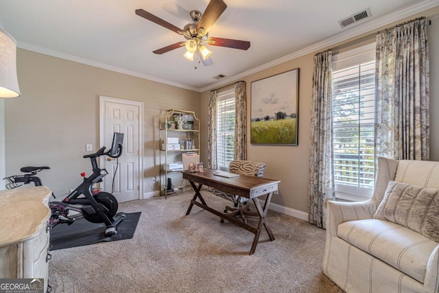 interior space featuring ceiling fan, crown molding, and carpet floors