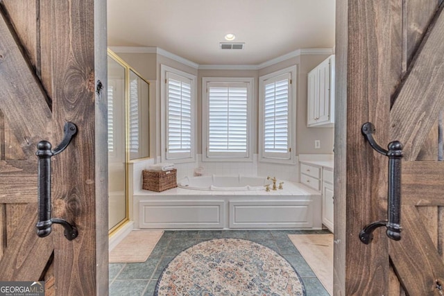 bathroom featuring crown molding, independent shower and bath, and tile patterned floors