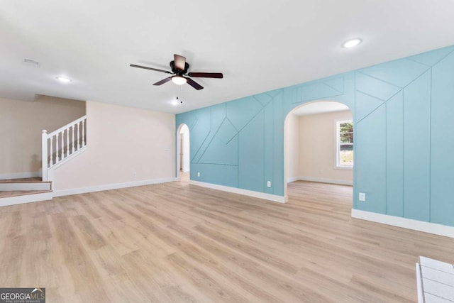 spare room with ceiling fan and light hardwood / wood-style flooring