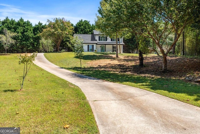 view of property's community with a yard