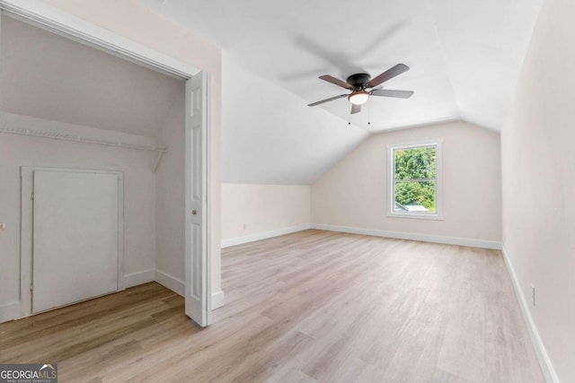 additional living space featuring vaulted ceiling, ceiling fan, and light hardwood / wood-style floors