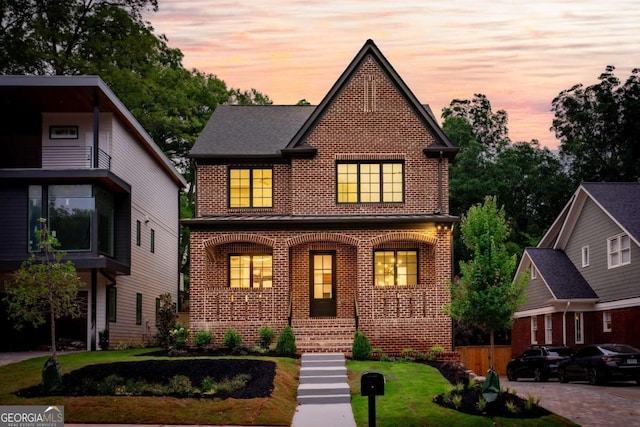 view of front of property with a yard