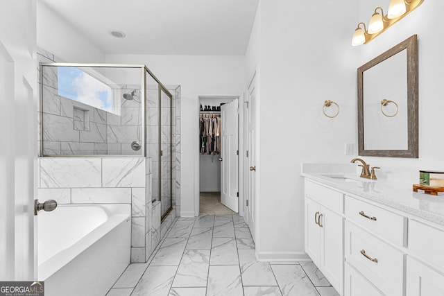 321 Brown Station Dr, Williamson, GA 30292 - bathroom with a garden tub, vanity, marble finish floor, a stall shower, and baseboards