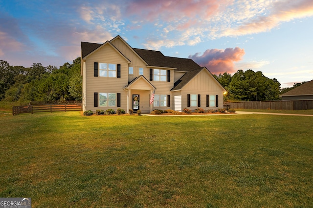 321 Brown Station Dr, Williamson, GA 30292 - traditional home with board and batten siding, fence, and a yard