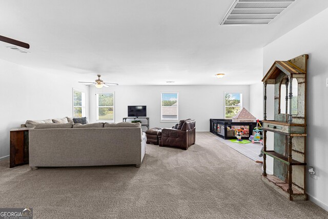 321 Brown Station Dr, Williamson, GA 30292 - carpeted living room featuring visible vents, baseboards, and ceiling fan