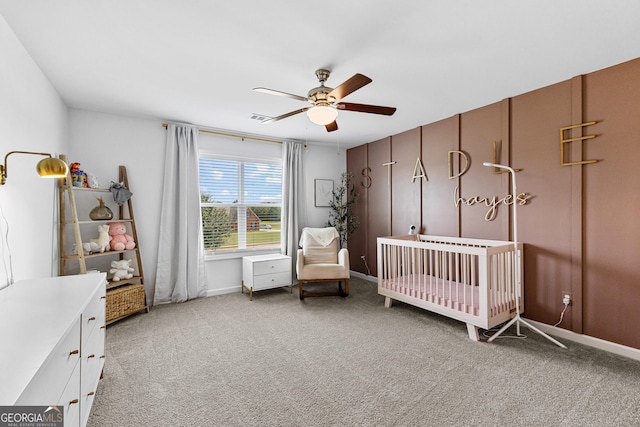 321 Brown Station Dr, Williamson, GA 30292 - carpeted bedroom with a nursery area, visible vents, baseboards, and a ceiling fan