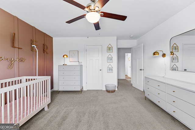 321 Brown Station Dr, Williamson, GA 30292 - bedroom featuring light carpet, ceiling fan, baseboards, and a nursery area