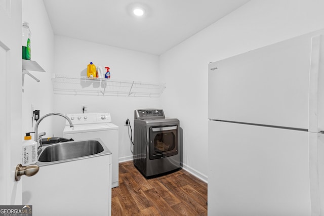 321 Brown Station Dr, Williamson, GA 30292 - laundry room featuring baseboards, dark wood-type flooring, washer and clothes dryer, laundry area, and a sink