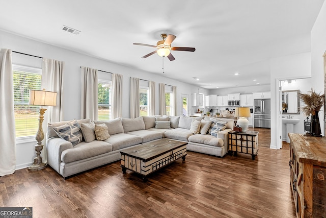 321 Brown Station Dr, Williamson, GA 30292 - living room featuring visible vents, ceiling fan, dark wood-style floors, and a healthy amount of sunlight