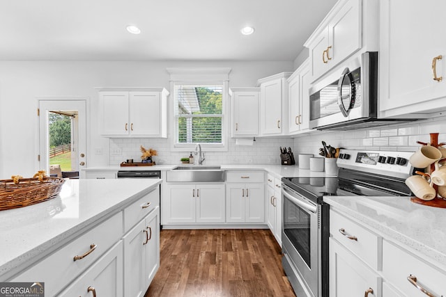 321 Brown Station Dr, Williamson, GA 30292 - kitchen featuring white cabinetry, a sink, a wealth of natural light, and stainless steel appliances