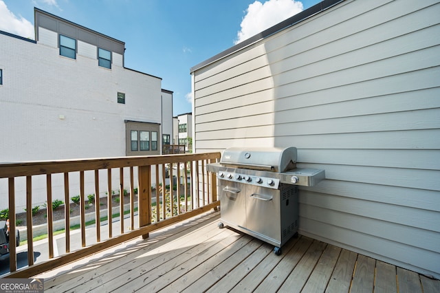 wooden deck featuring grilling area