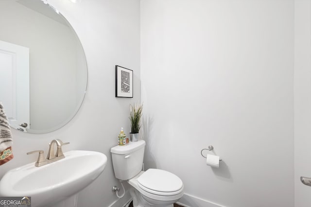 bathroom with toilet and sink