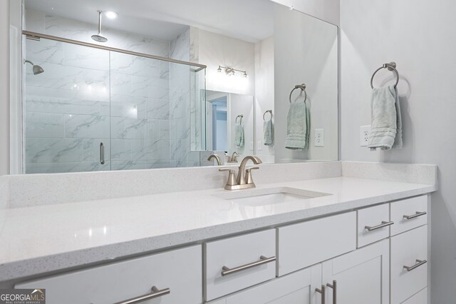 bathroom with vanity and an enclosed shower