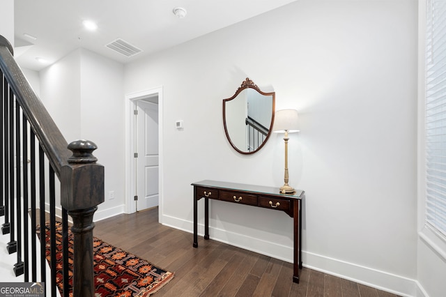 foyer with dark hardwood / wood-style floors