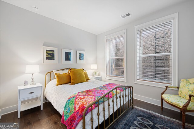 bedroom featuring dark hardwood / wood-style floors