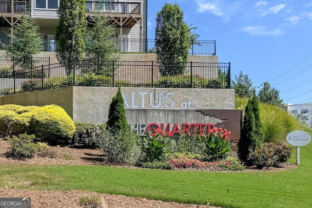 community / neighborhood sign featuring a lawn