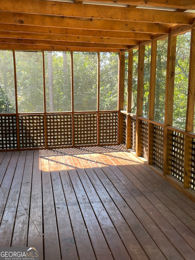 unfurnished sunroom with a healthy amount of sunlight