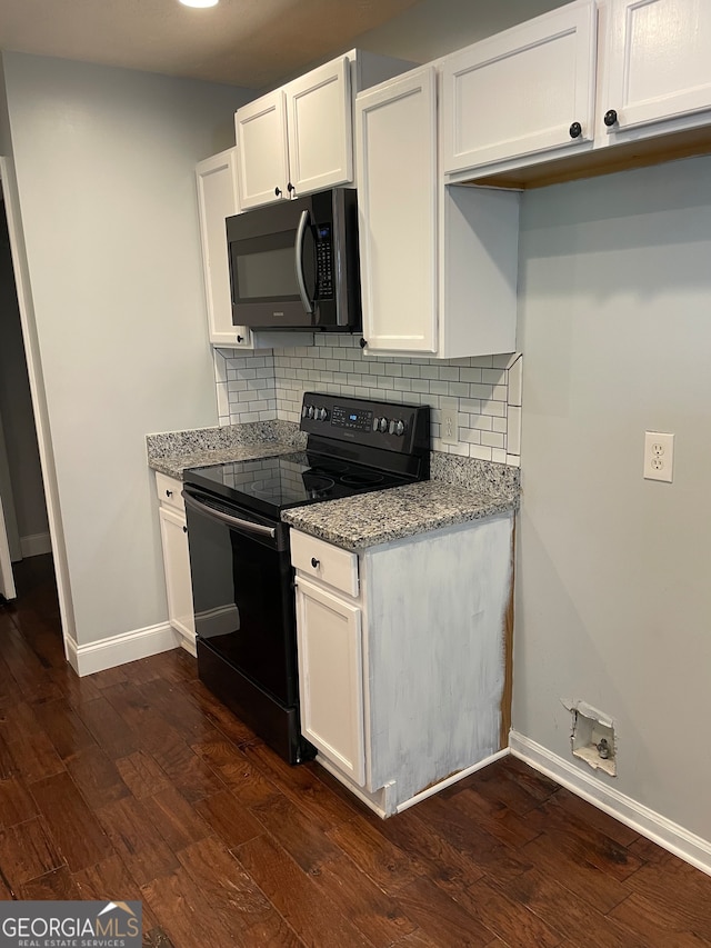 kitchen with light stone counters, dark hardwood / wood-style floors, white cabinets, decorative backsplash, and black range with electric cooktop