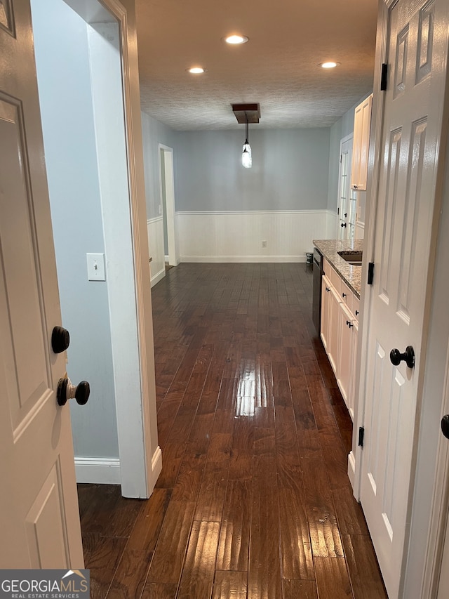 hallway with dark wood-type flooring