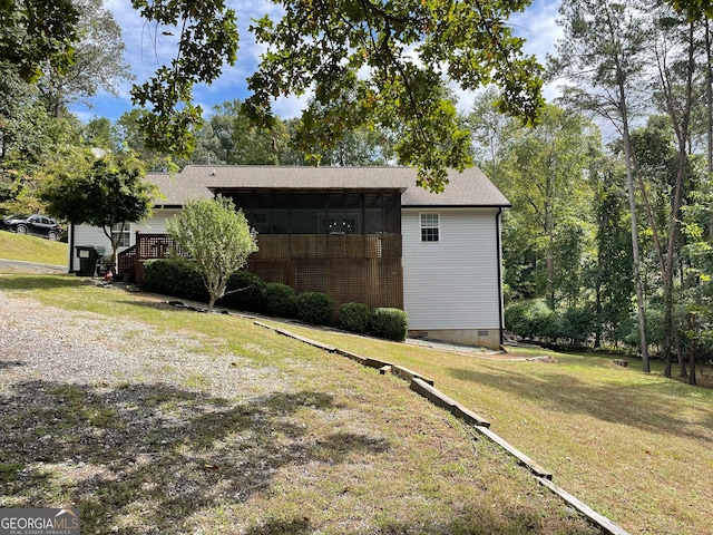 view of outbuilding with a yard