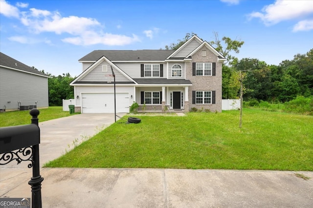 view of front of house featuring a garage and a front yard