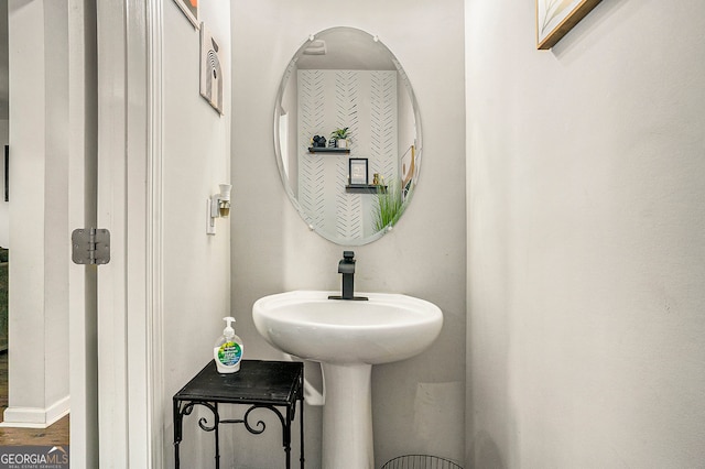 bathroom with hardwood / wood-style flooring