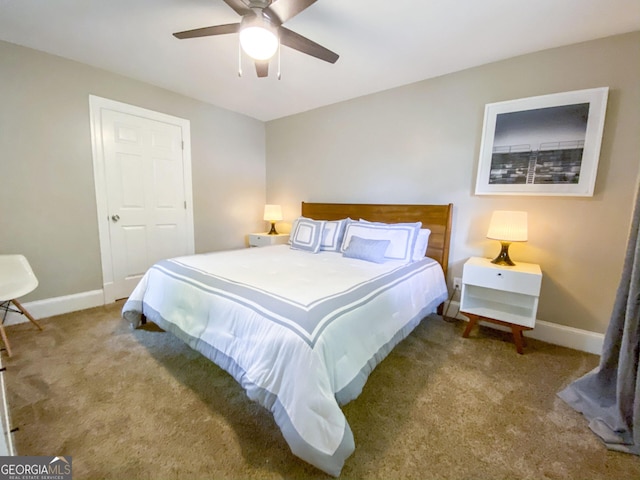 carpeted bedroom with ceiling fan