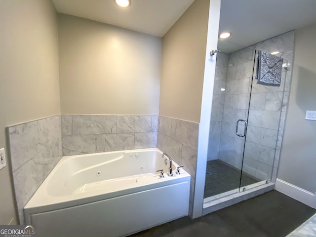 bathroom with separate shower and tub