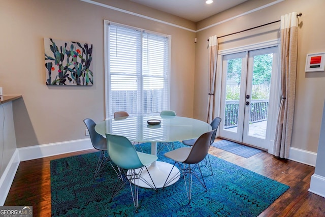 dining room featuring plenty of natural light, dark hardwood / wood-style floors, and french doors