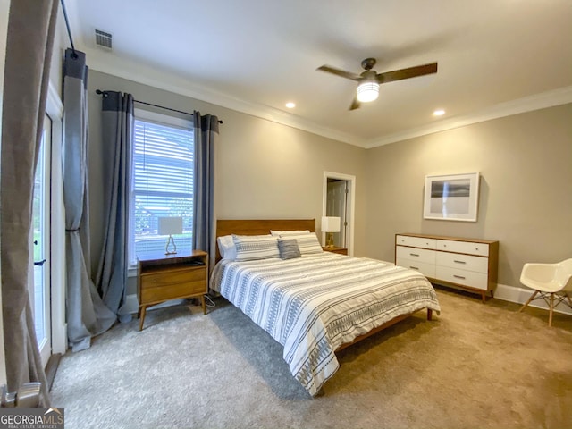 bedroom featuring light carpet, crown molding, and ceiling fan