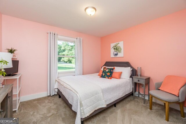 bedroom with light colored carpet