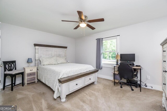 bedroom featuring ceiling fan and light carpet