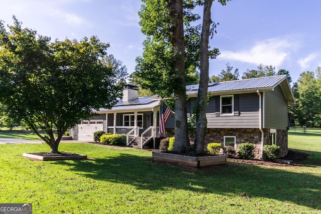 view of front of house featuring a garage and a front yard